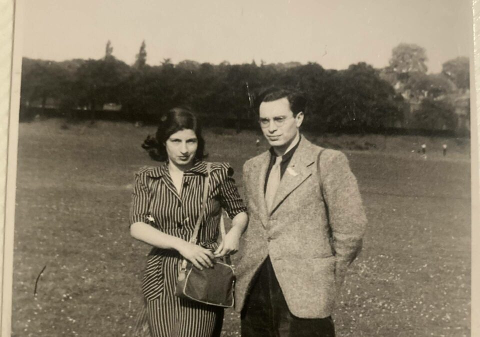 Man and woman linking arms in a sepia photograph