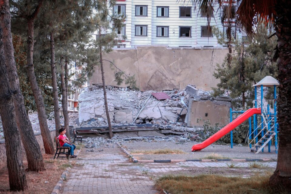 Destroyed building and childrens playground